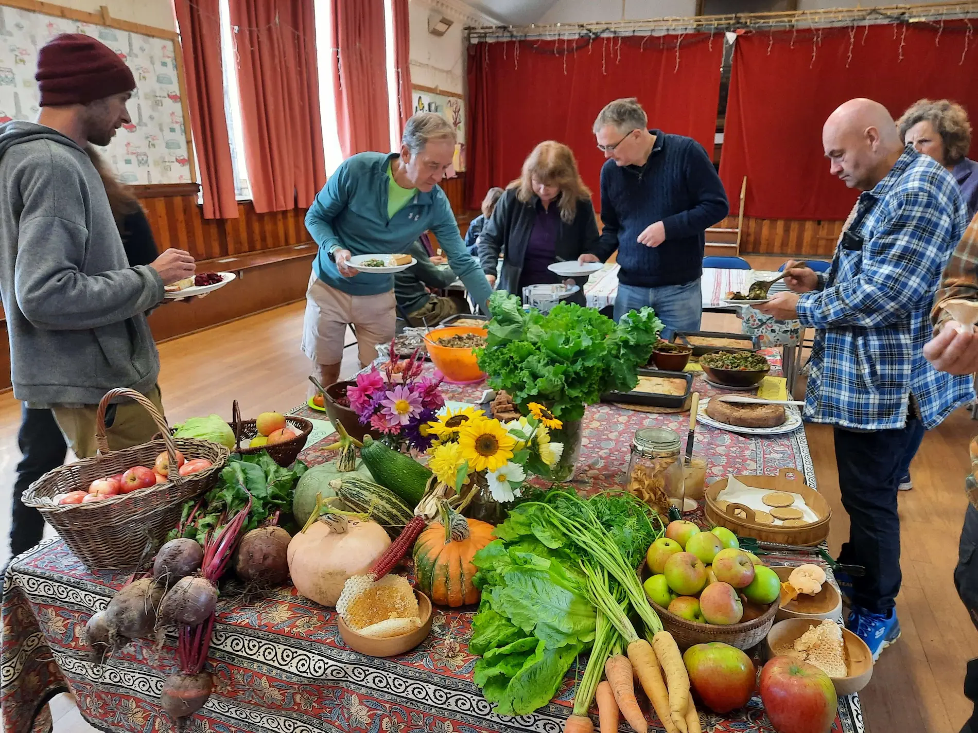 Table Full Of Local Veg People Admiring At Side